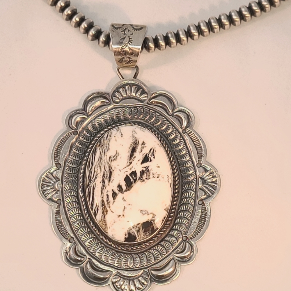 Native American signed pendant and chain. Sterling and White Buffalo Turquoise